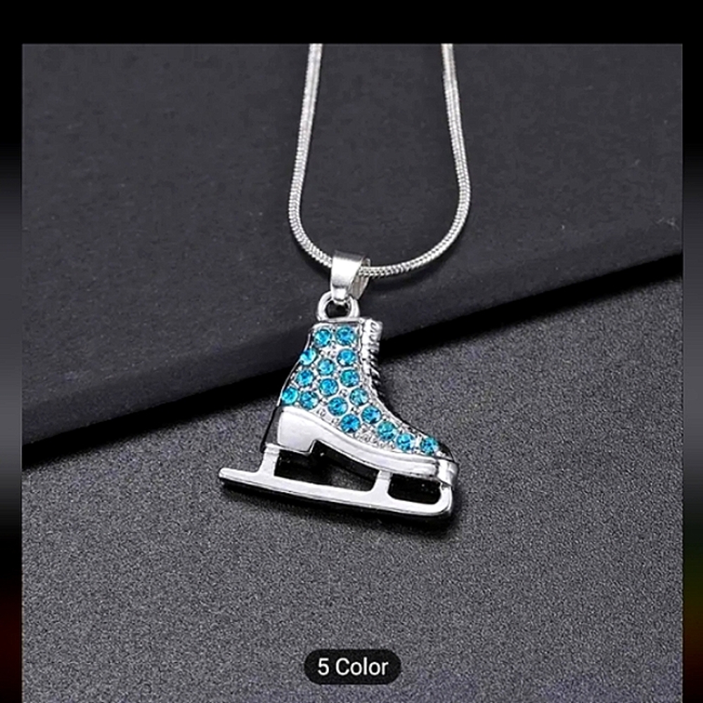 Iced out ice skates with a sterling silver necklace